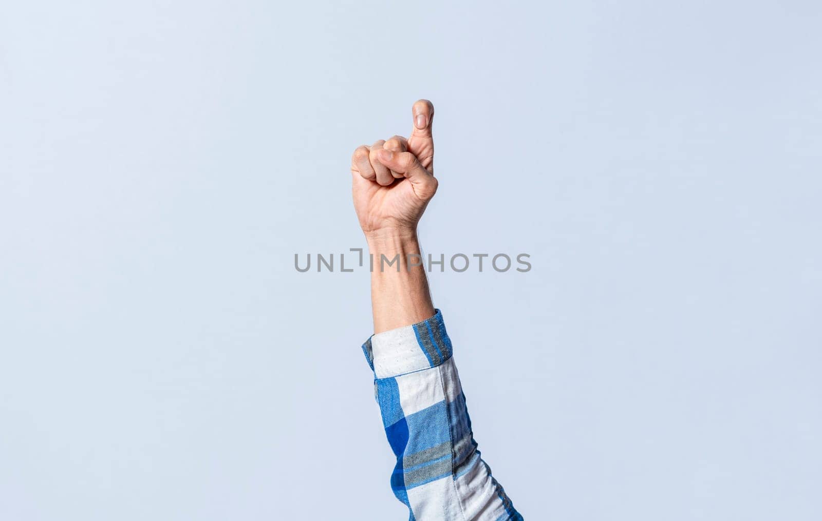 Hand gesturing the letter Z in sign language on an isolated background. Man's hand gesturing the letter Z of the alphabet isolated. Letter Z of the alphabet in sign language