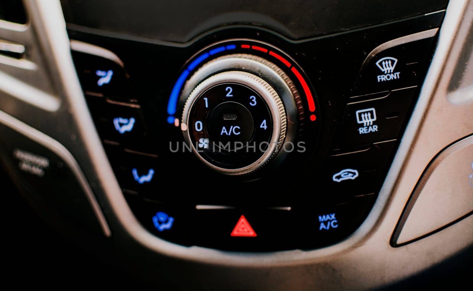 Front view of a car air conditioning control panel. Air conditioning knob of a car. Close up of automotive air conditioning switch panel