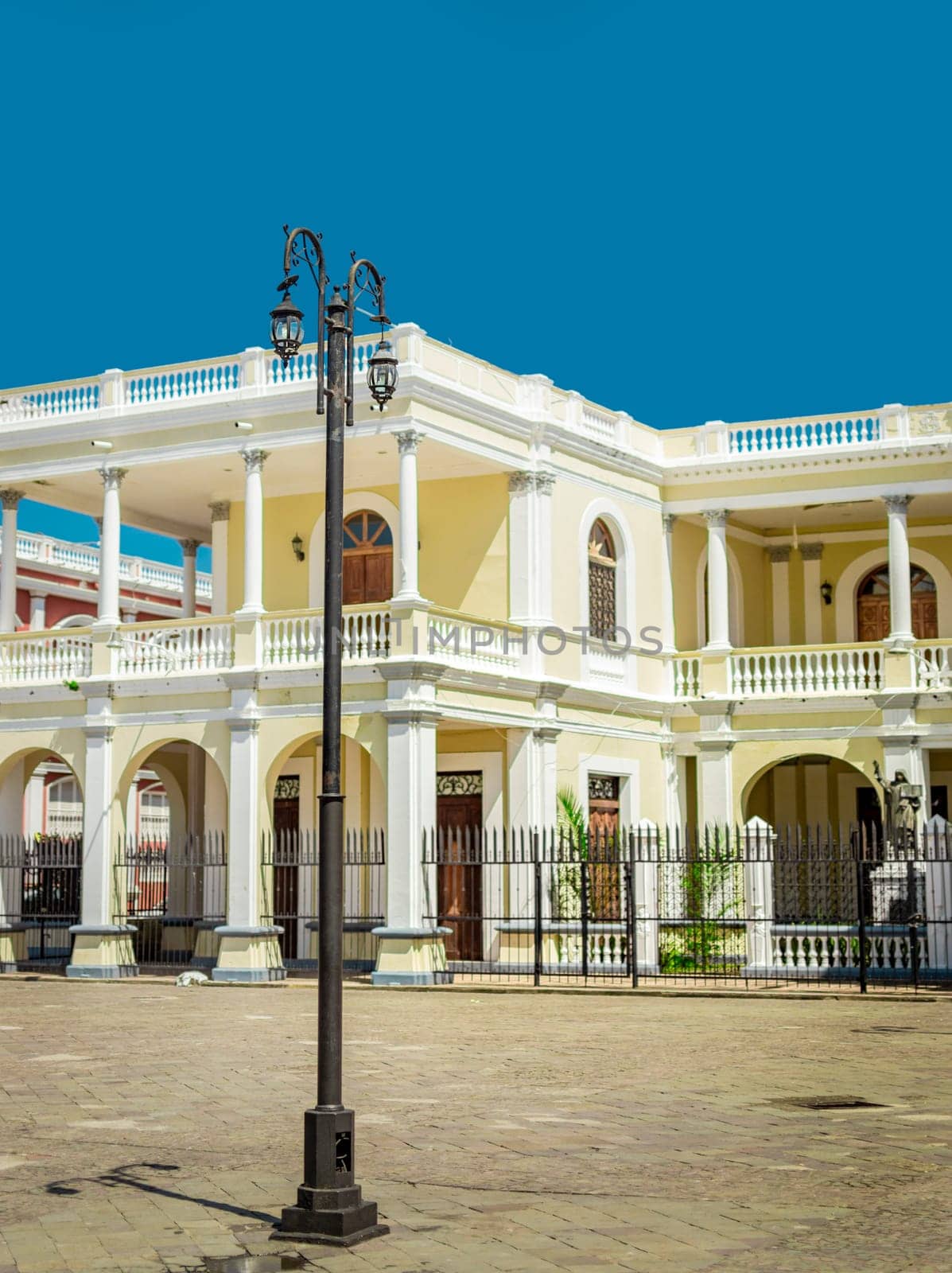 A lantern pole in a square with copy space, An illuminated lantern pole, Public lantern pole, Public lighting pole