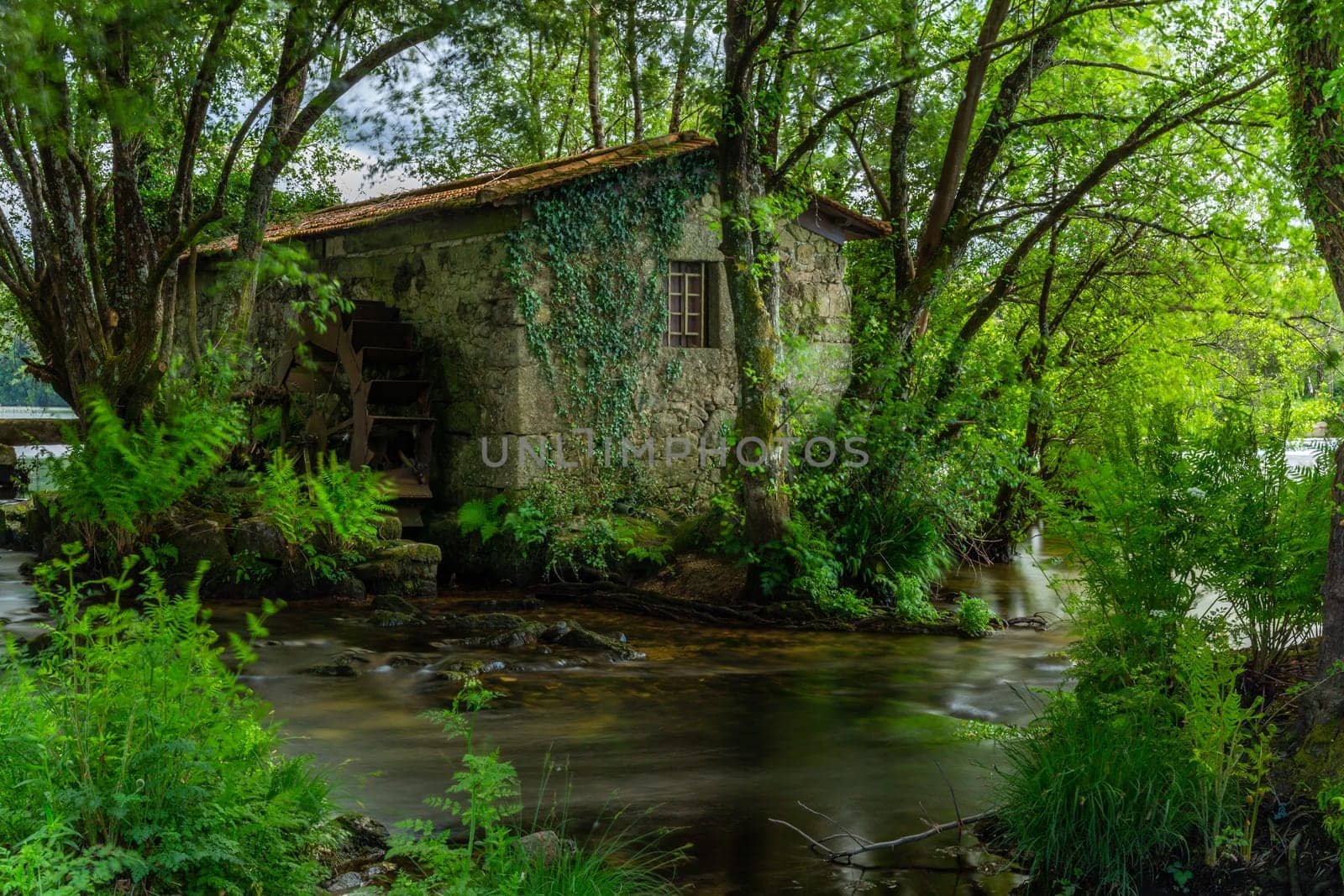 Long exposure near an ancient watermill in Cavado river, Braga, Portugal