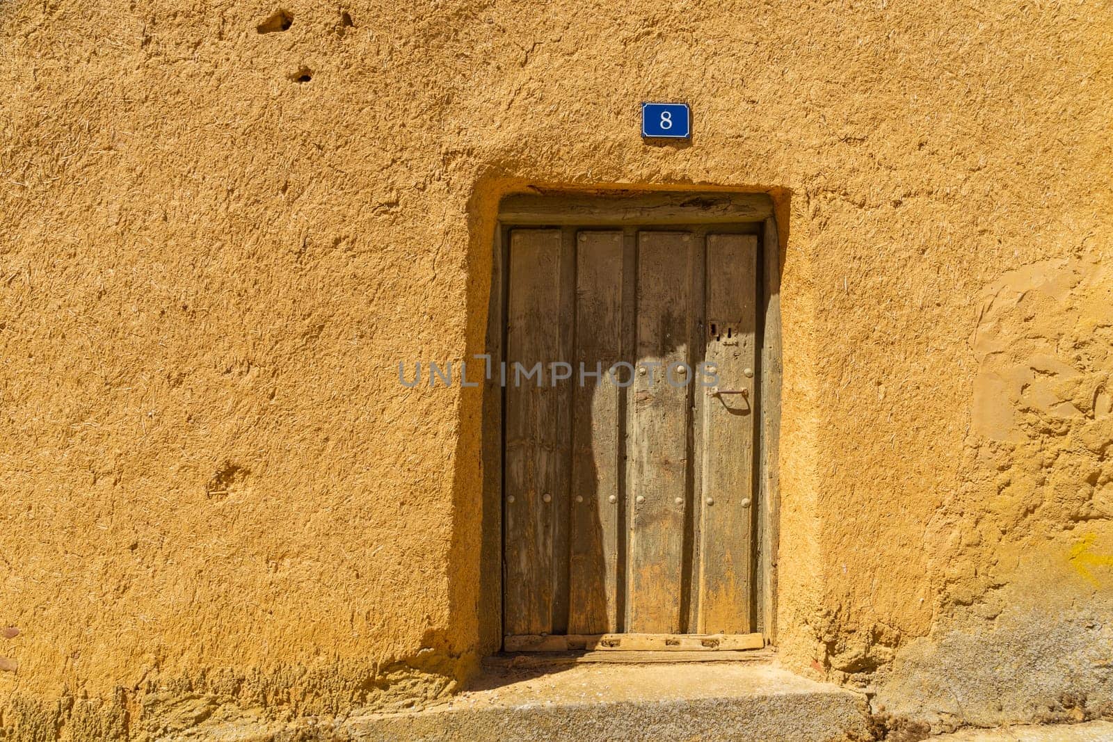 Mazarife, Castile and Leon, Spain: 12 August 2022: Villar de Mazarife famous old door, province Leon, Spain. Camino de Santiago.