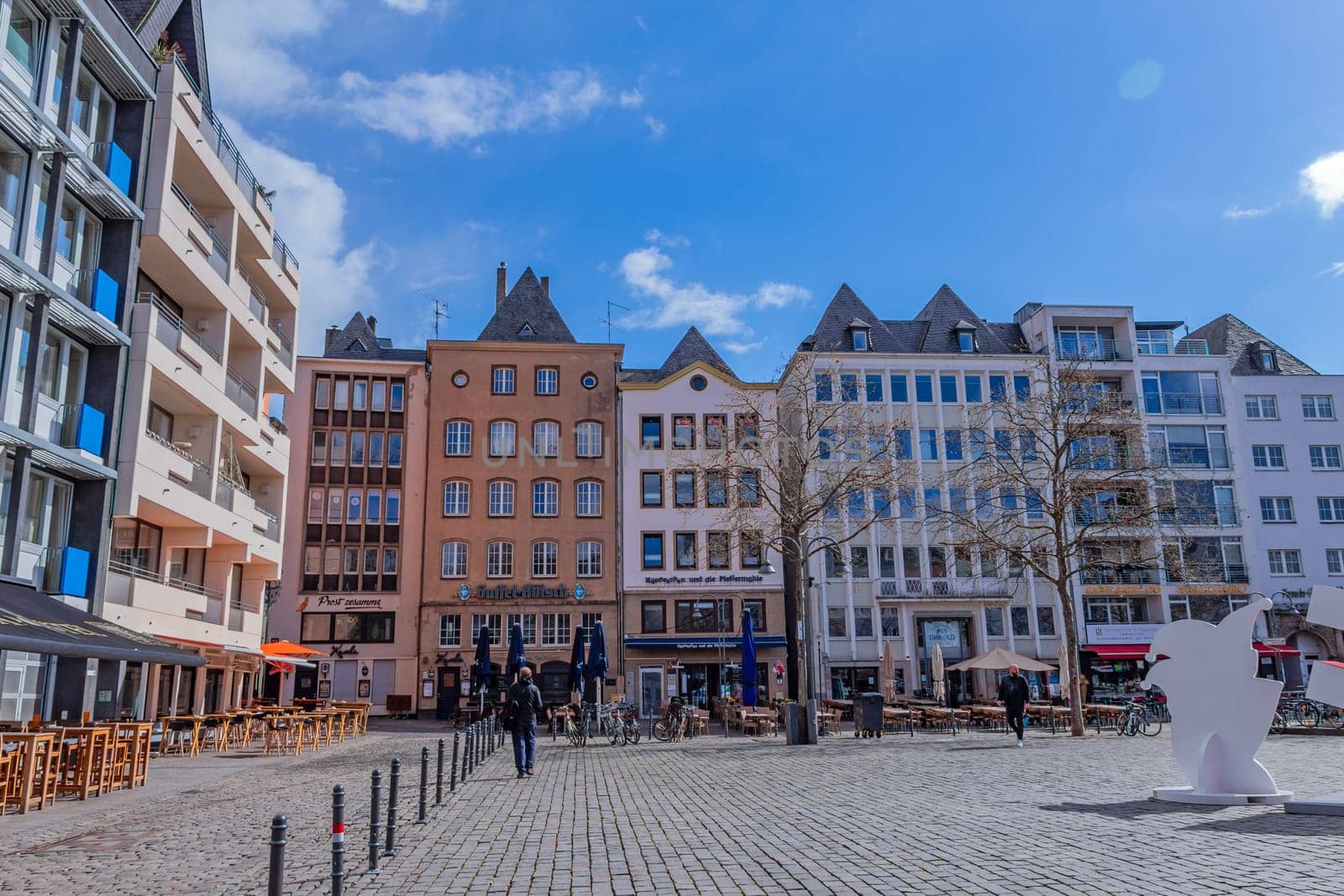 Cologne, Germany - 23 March 2023: Alter Markt (old market) historic square in the Altstadt (old town) is now the centre of night life with pubs and bars