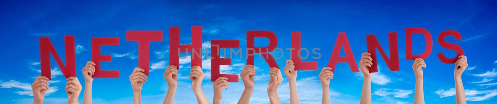 People Or Persons Hands Building English Word Netherlands. Blue Sky As Background.
