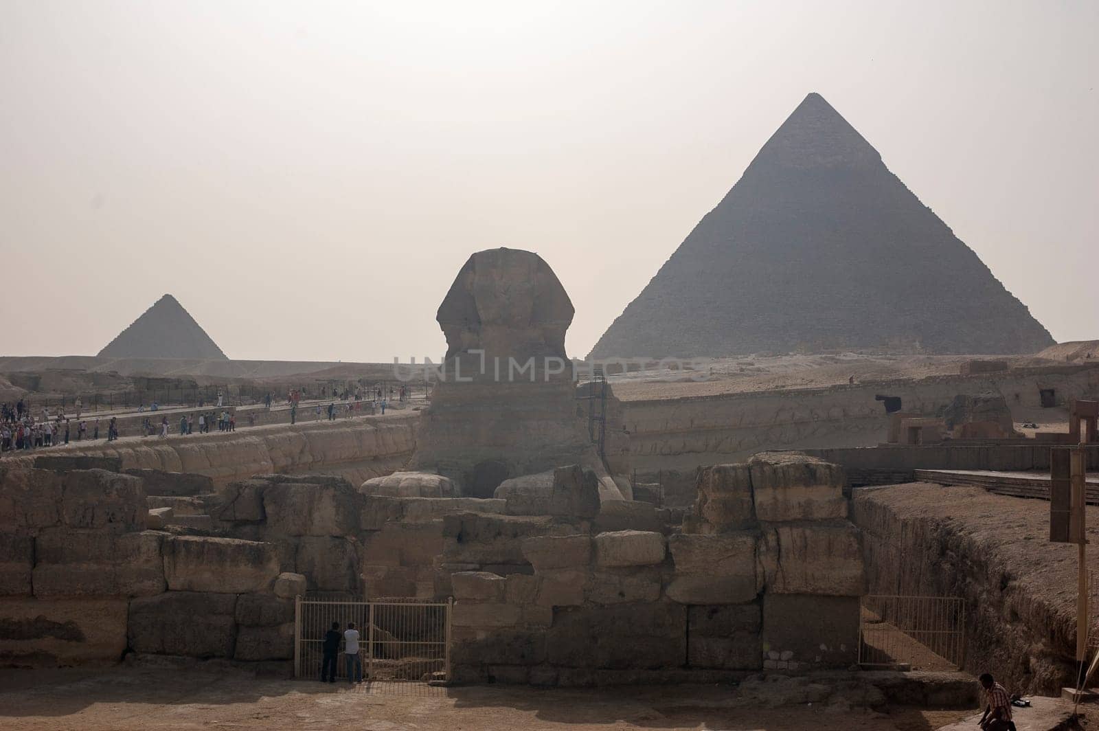 Giza, Egypt - April 13 2008: Sphinx and pyramids (Cheops and Khafre) in the archeological site of Giza. Egypt.