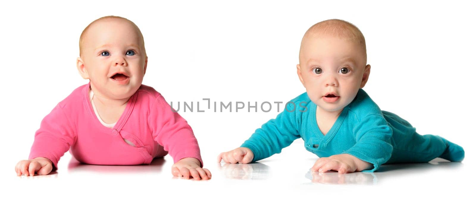 Six month old twin brother and sister on white