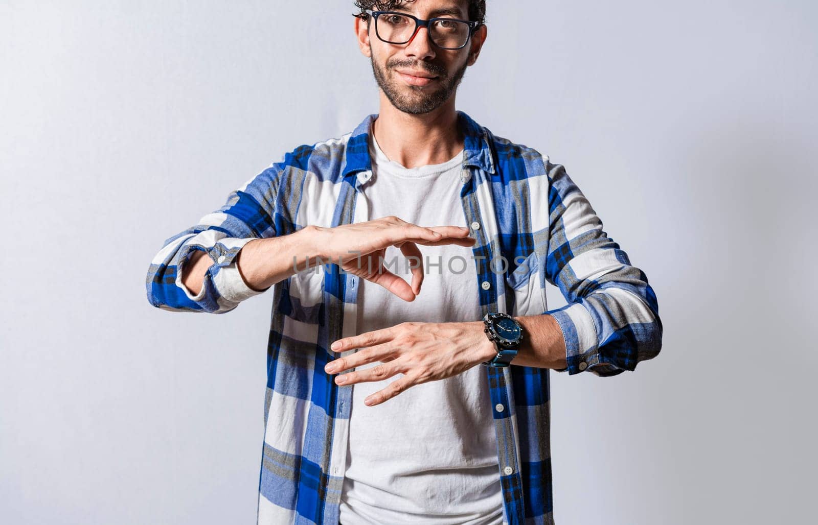 Young man gesturing in sign language, People who speak in sign language. Manual gestures of people with hearing problems, Person speaking in sign language isolated