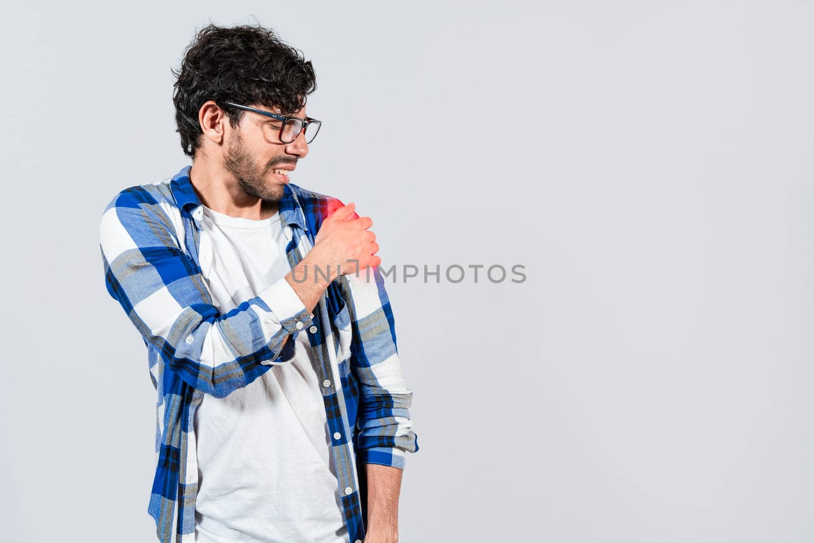 Man suffering from upper arm inflammation. Arm and shoulder pain concept. People with upper arm pain isolated, muscle tension problems, Man with upper arm muscle pain