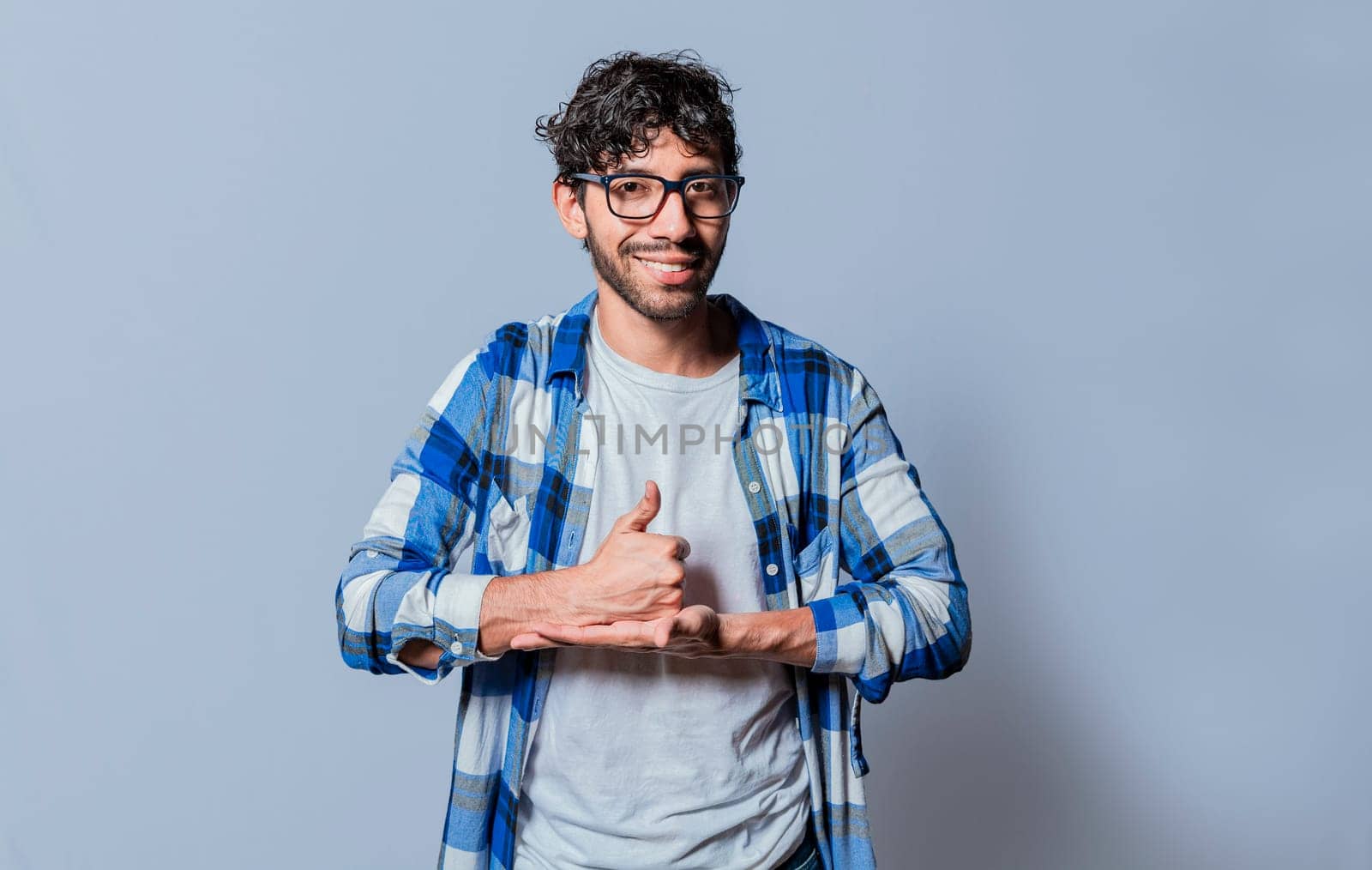 Person gesturing help with hands in sign language, Young man showing help gesture with hands in sign language. Interpreter man gesturing help with hands in sign language