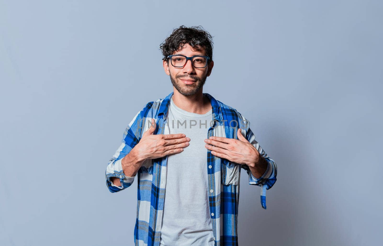 Smiling person gesturing the word HAPPINESS in sign language, Interpreter man gesturing the word HAPPINESS in sign language. Young man gesturing THANKFUL in sign language