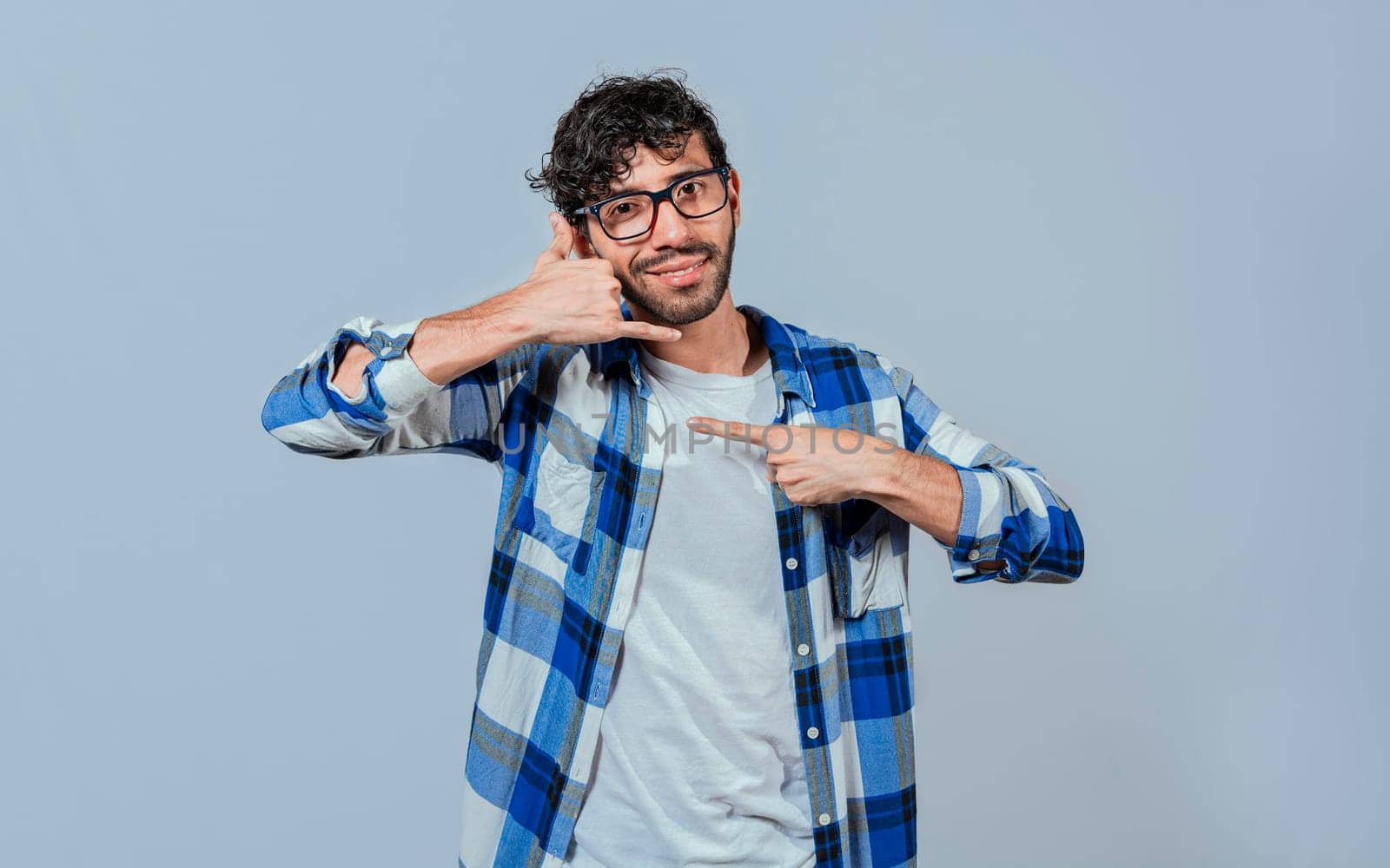 Interpreter man gesturing CALL ME in sign language. Person gesturing CALL ME in sign language, Young man gesturing CALL ME in sign language. Manual gestures of people with hearing problems