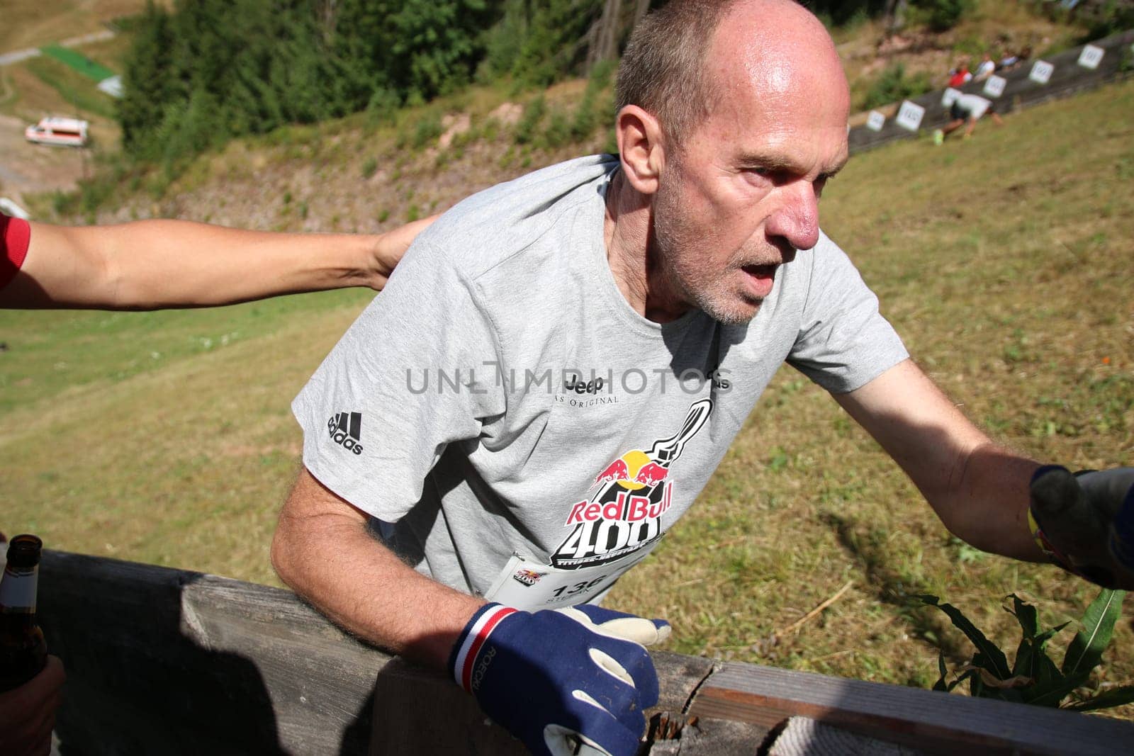 This runner hangs on the gang at the . Red Bull 400 - Germany premiere Titisee-Neustadt up the slope....