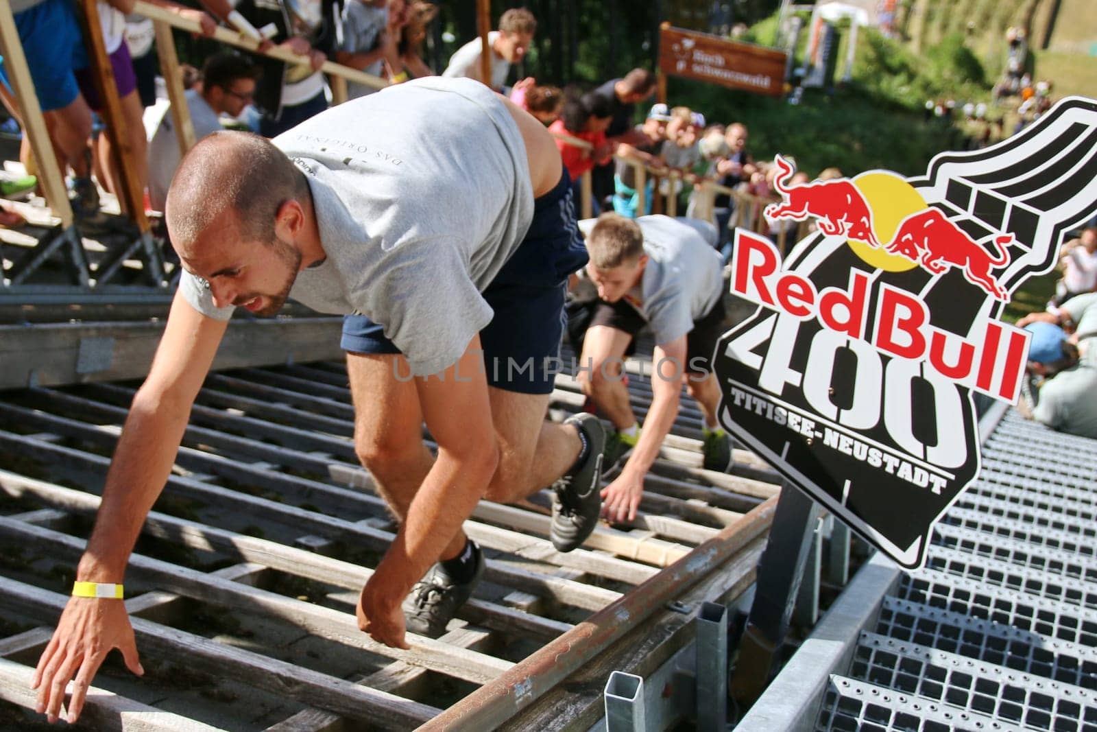 The participants at the Red Bull 400 - Germany premiere Titisee-Neustadt have to bite their teeth on their way to the start house of the Hochfirstschanze