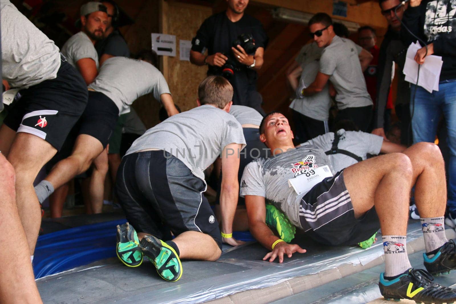 Exhausted but happy,the participants of the final at the Red Bull 400 - Germany premiere Titisee-Neustadt are in the finish of the start house of the Hochfirstschanze