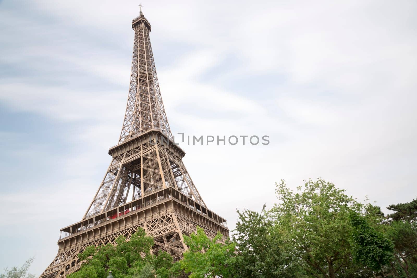 Eiffel Tower in Paris, France with trees in front of it.