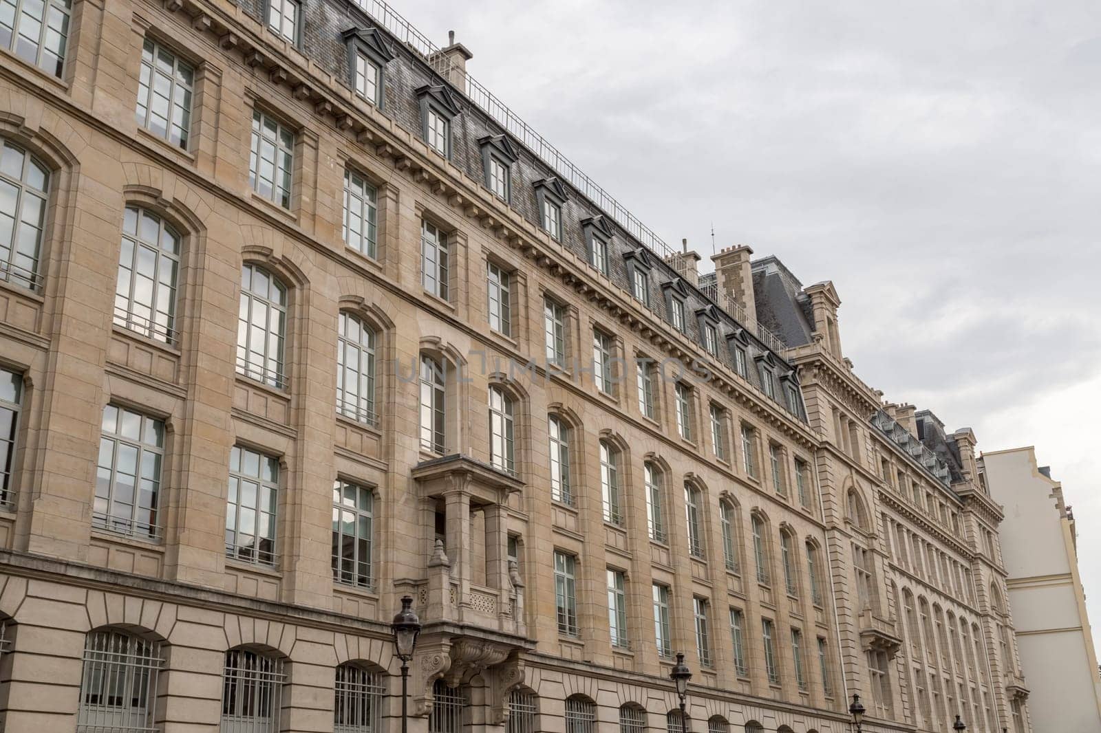 Building Facade in Paris, France with clouds.