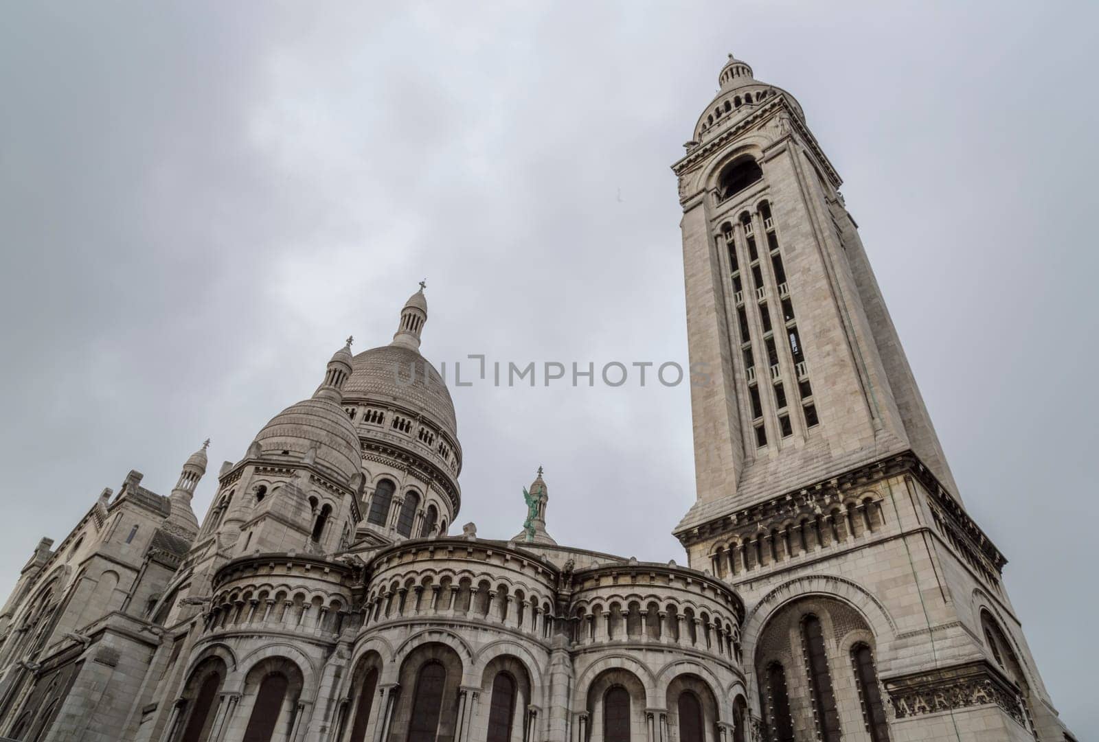 The  Sacre Coeur Church in Paris, France with cloudy sky.