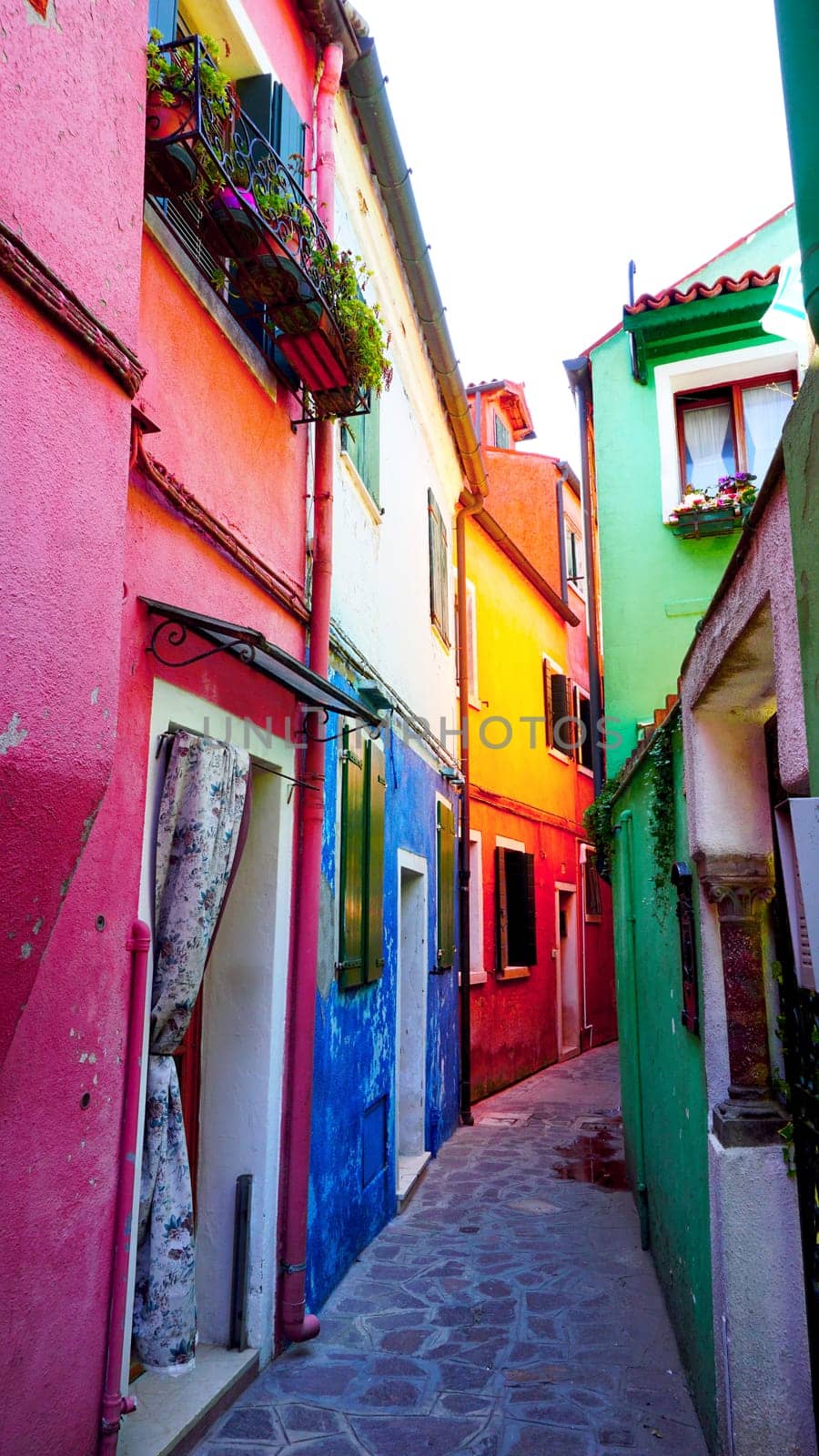 Burano colorful building architecture in alley, Venice, Italy