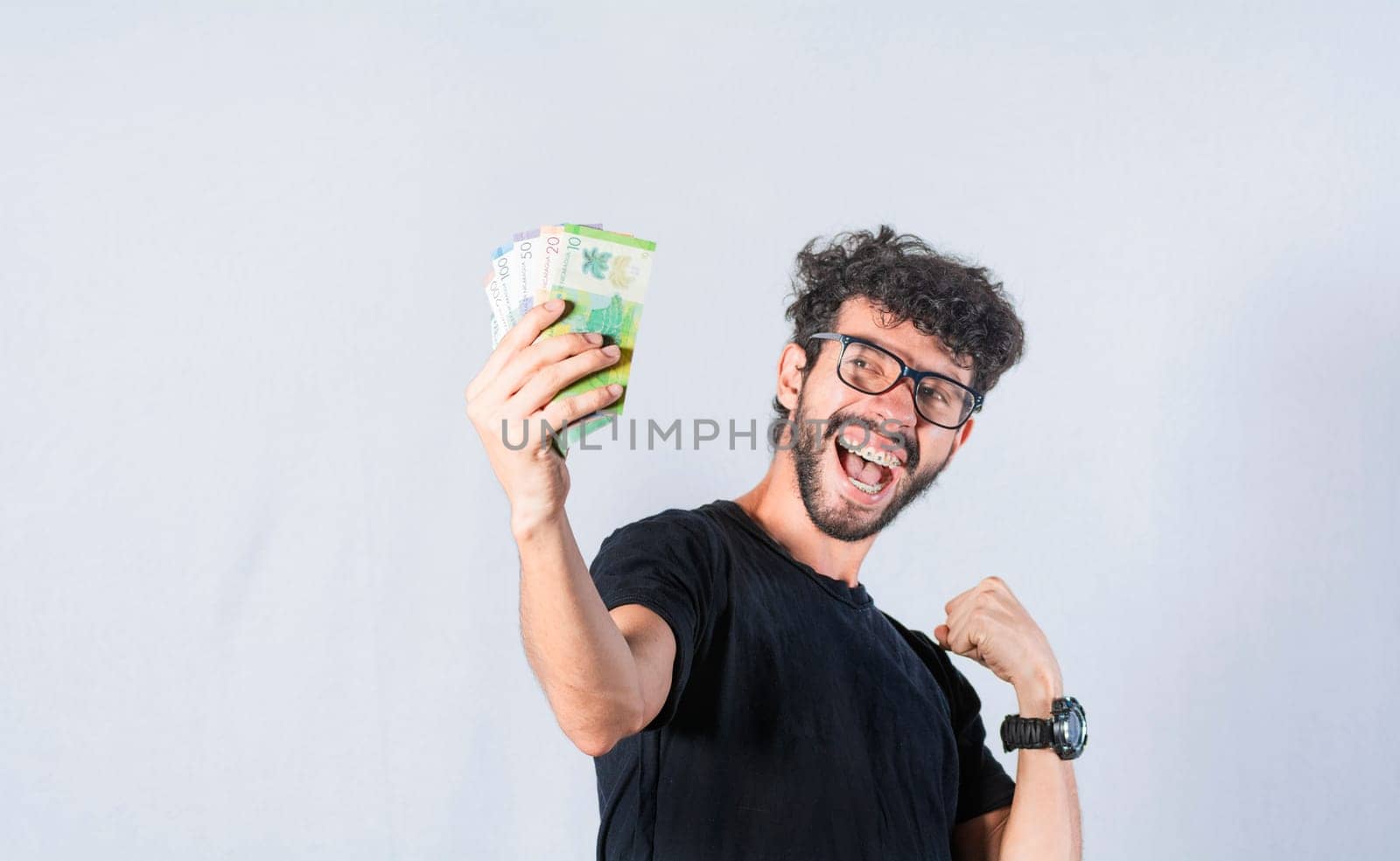 Happy person with money in hand, astonished man with banknotes in his hand, Excited person with money in his hand isolated.