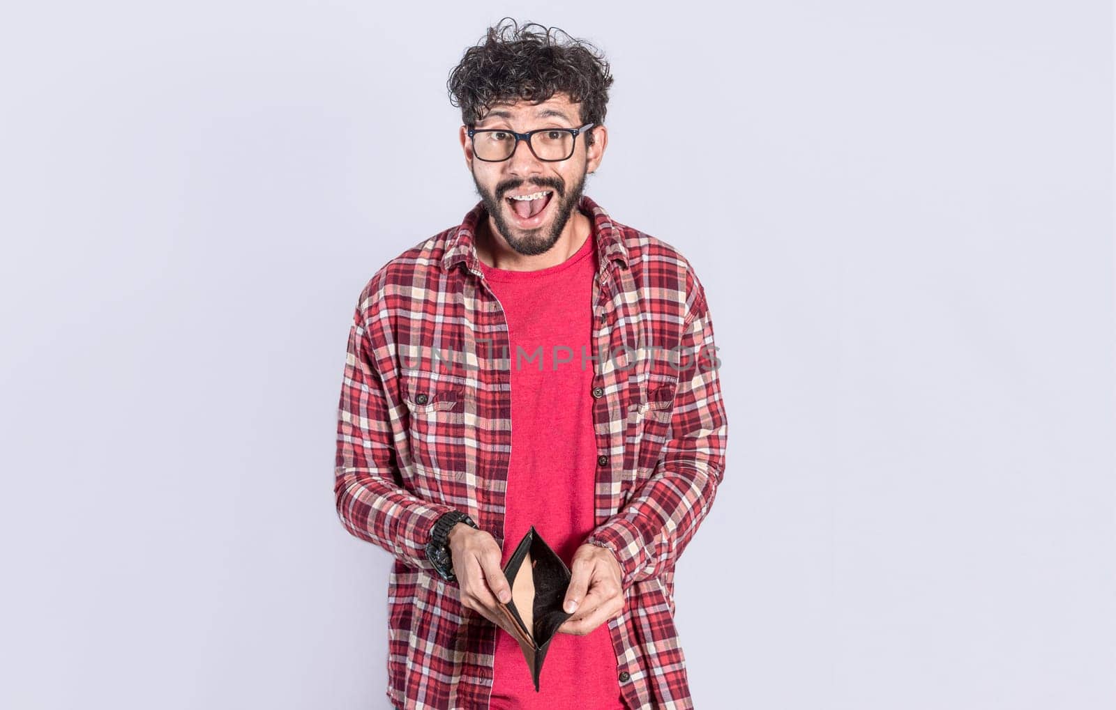 unhappy and shocked man looking into an empty wallet, Surprised person seeing his empty wallet, young man with wallet without money on white background