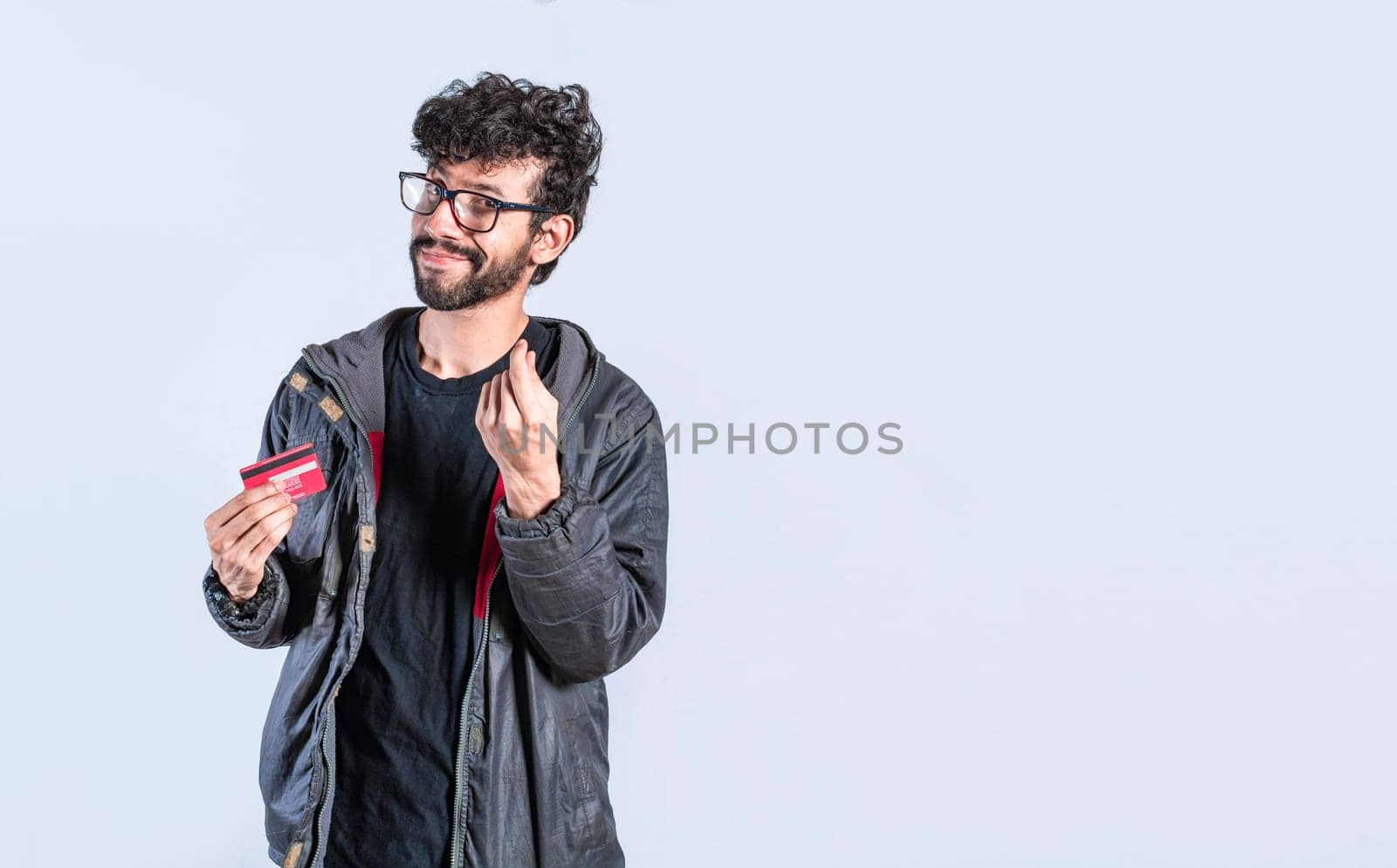 Handsome man with credit card making money gesture with fingers, Smiling person showing credit card making money gesture with fingers, Electronic payment concept