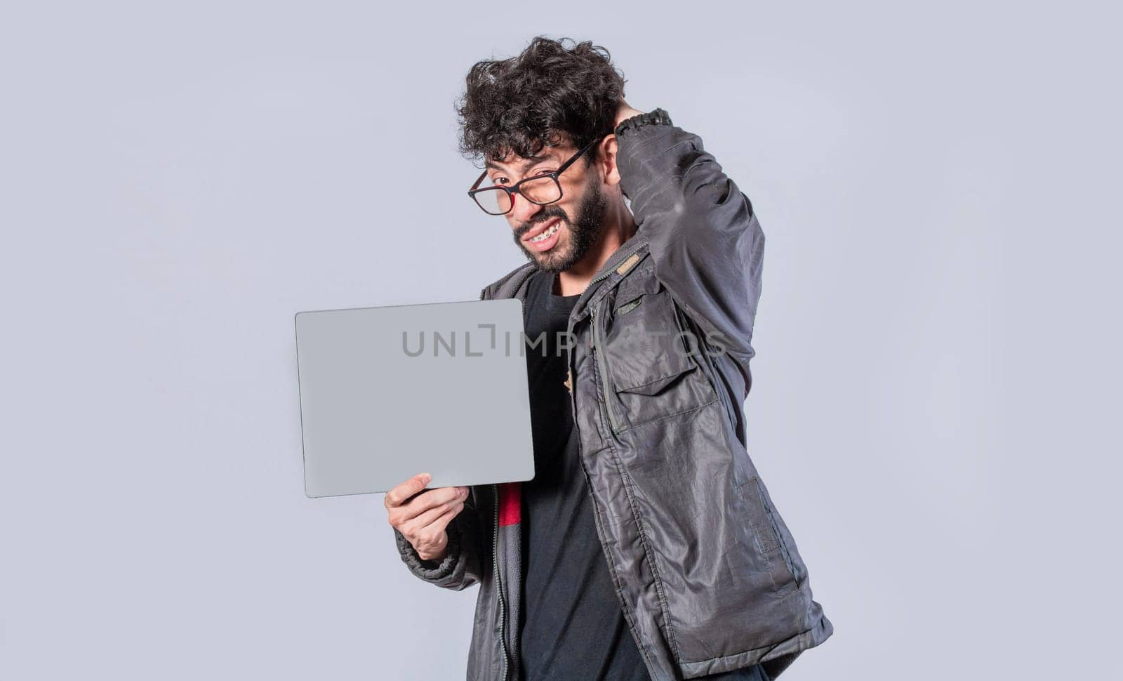 Young man with hand on head showing poster, man showing blank signboard isolated, guy showing signboard with blank space