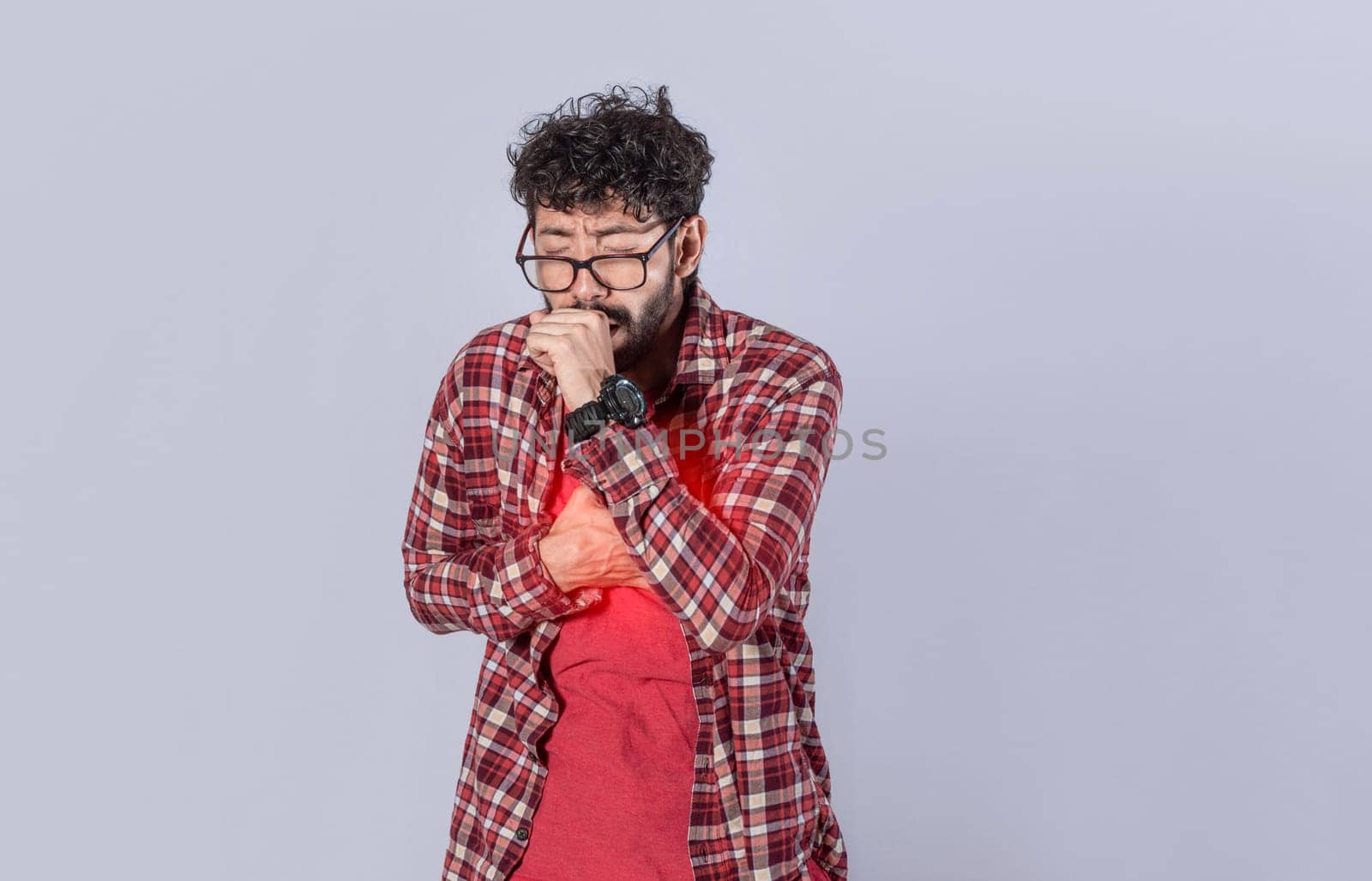 Young man with cough and chest pain, coughing on isolated background. man with pneumonia and bronchitis problems, concept of person with cough and pneumonia problems