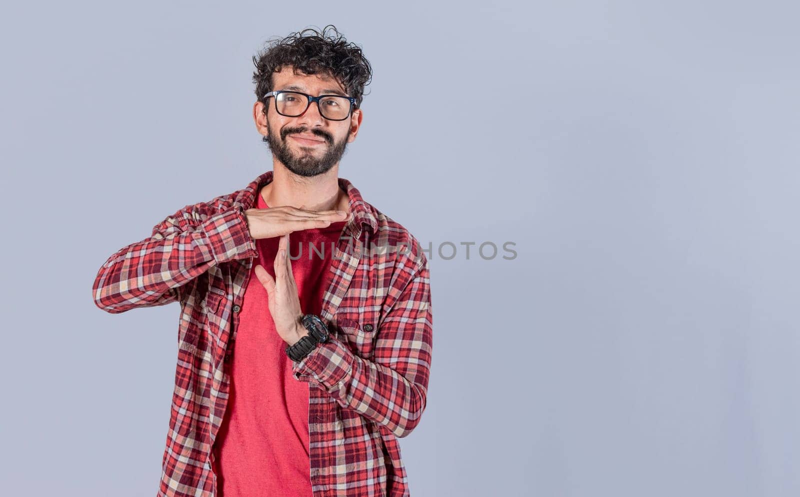 A man gesturing time out, Man doing time out gesture, latin guy doing time out gesture