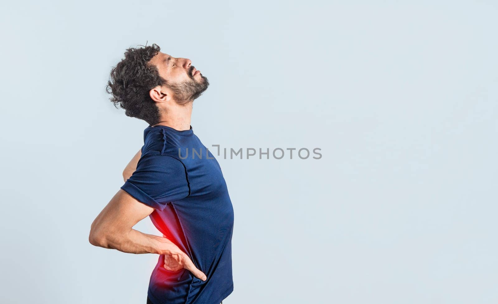 Man with spine problems, person with back problems on isolated background, lumbar problems concept, a sore man with back pain