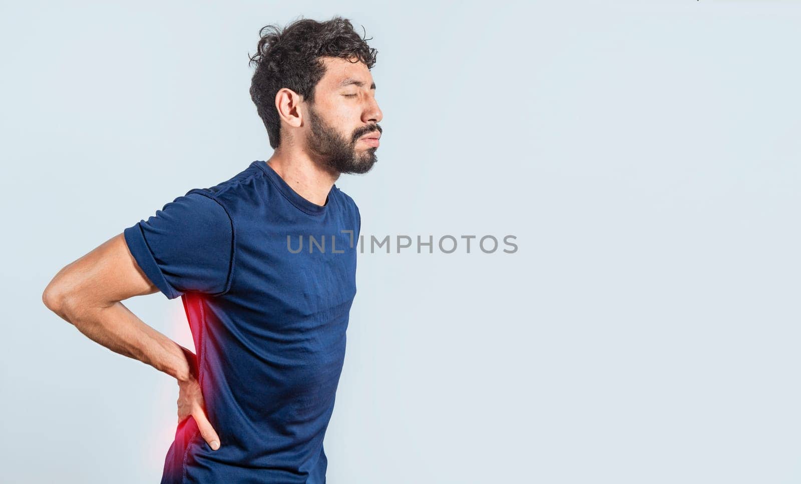 Man with spine problems, person with back problems on isolated background, lumbar problems concept, a sore man with back pain