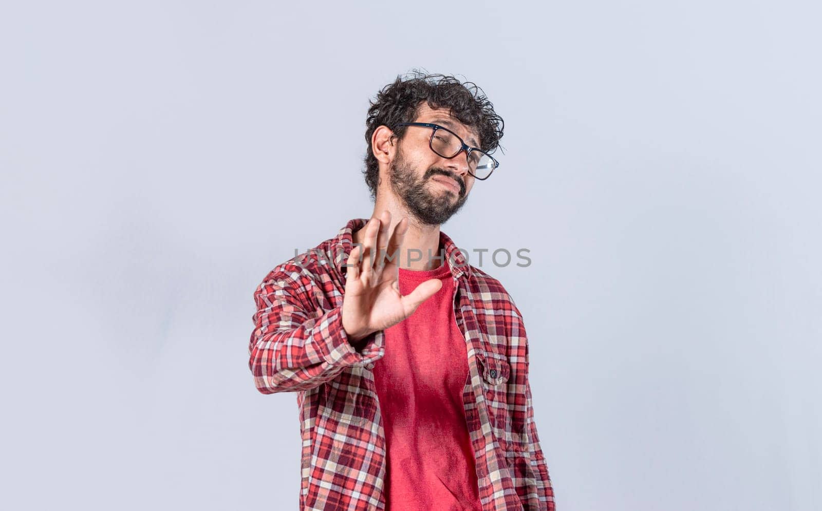 man rejecting with one hand, a man with rejection expression, isolated man with hand rejecting