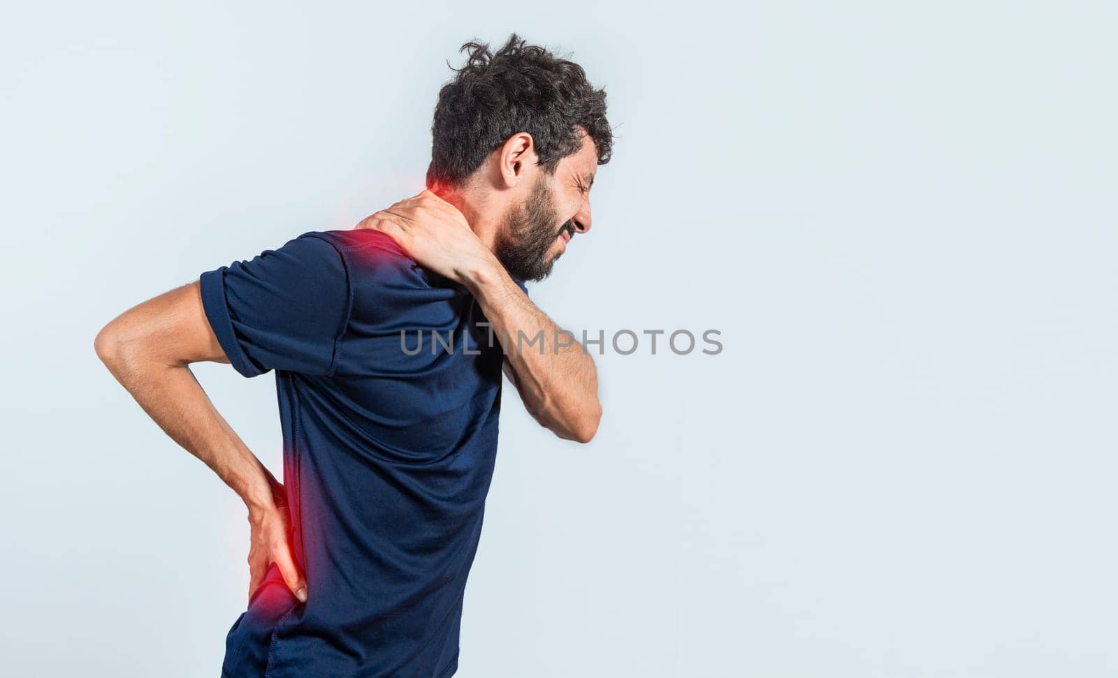Man with spine and shoulder problems, person with back and shoulder problems on isolated background, lumbar and muscular problems concept