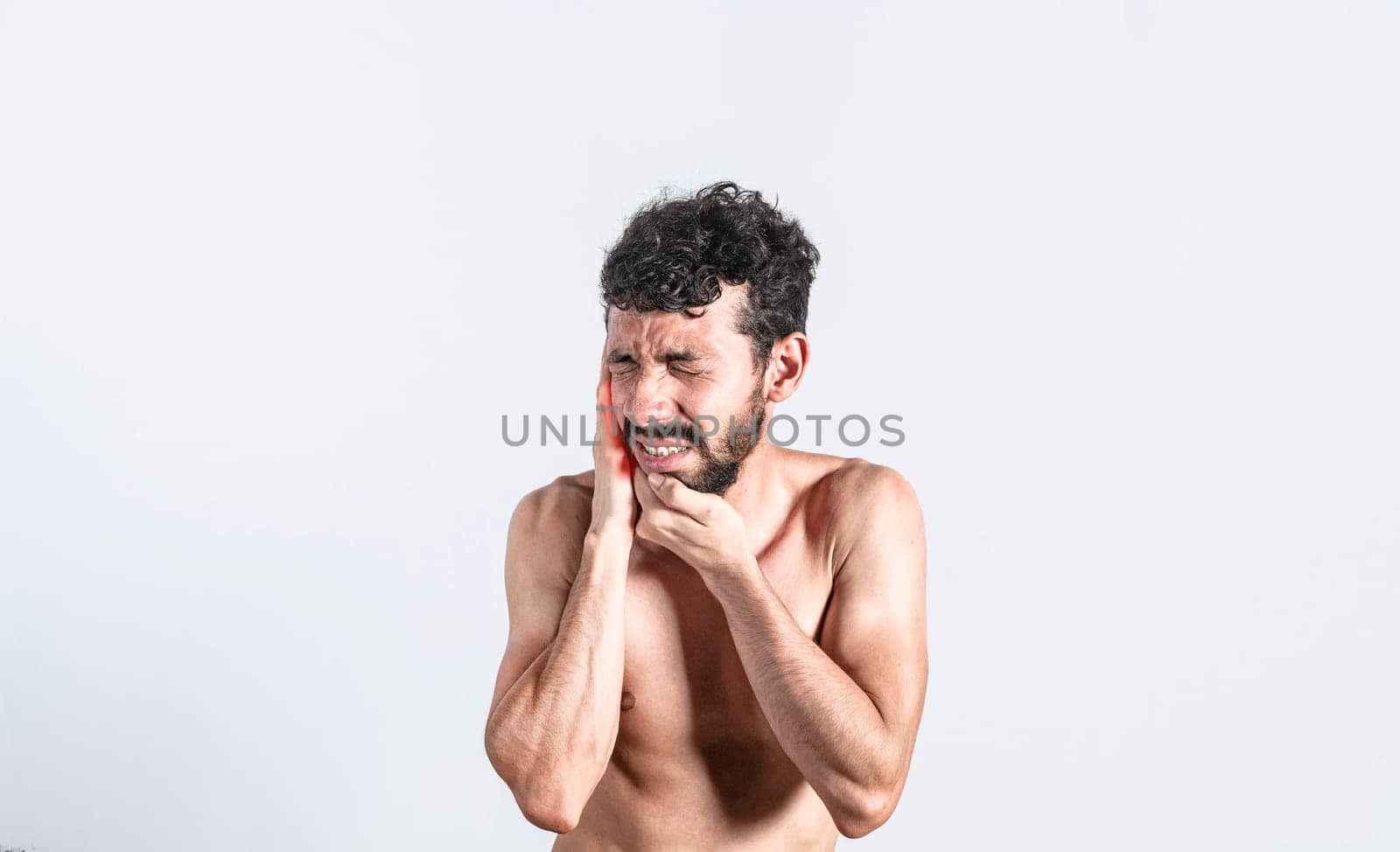Person with earache on isolated background, man with earache on isolated background, ear disease concept