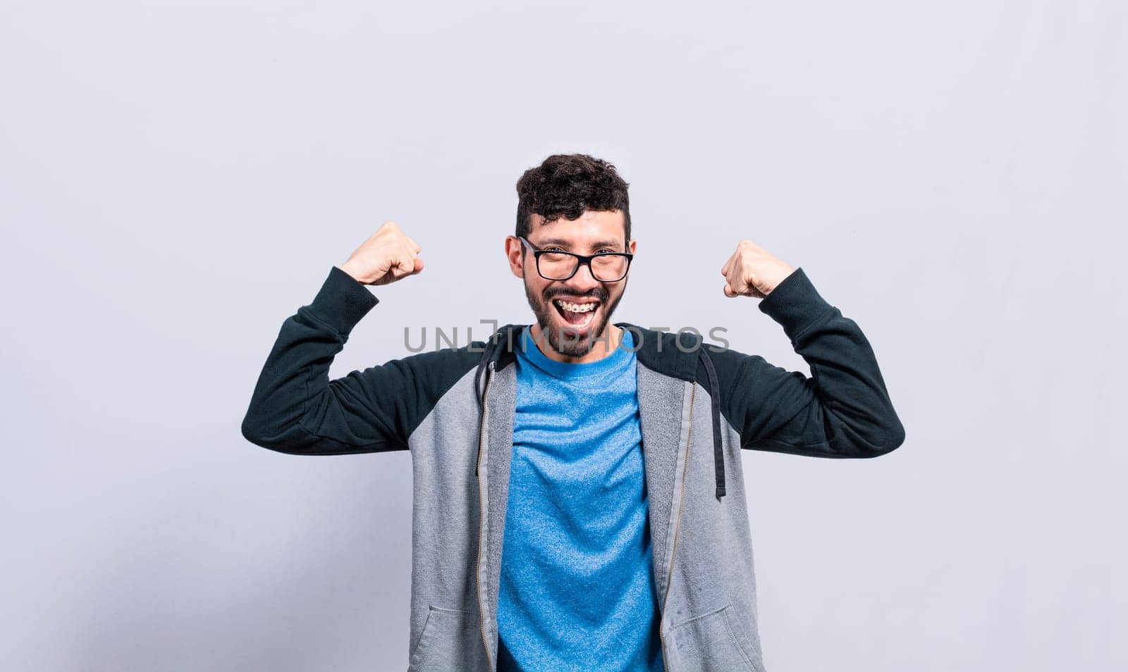 Person with Happy face raising arms in victory gesture isolated, winner person celebrating victory isolated, excited man raising arms celebrating victory