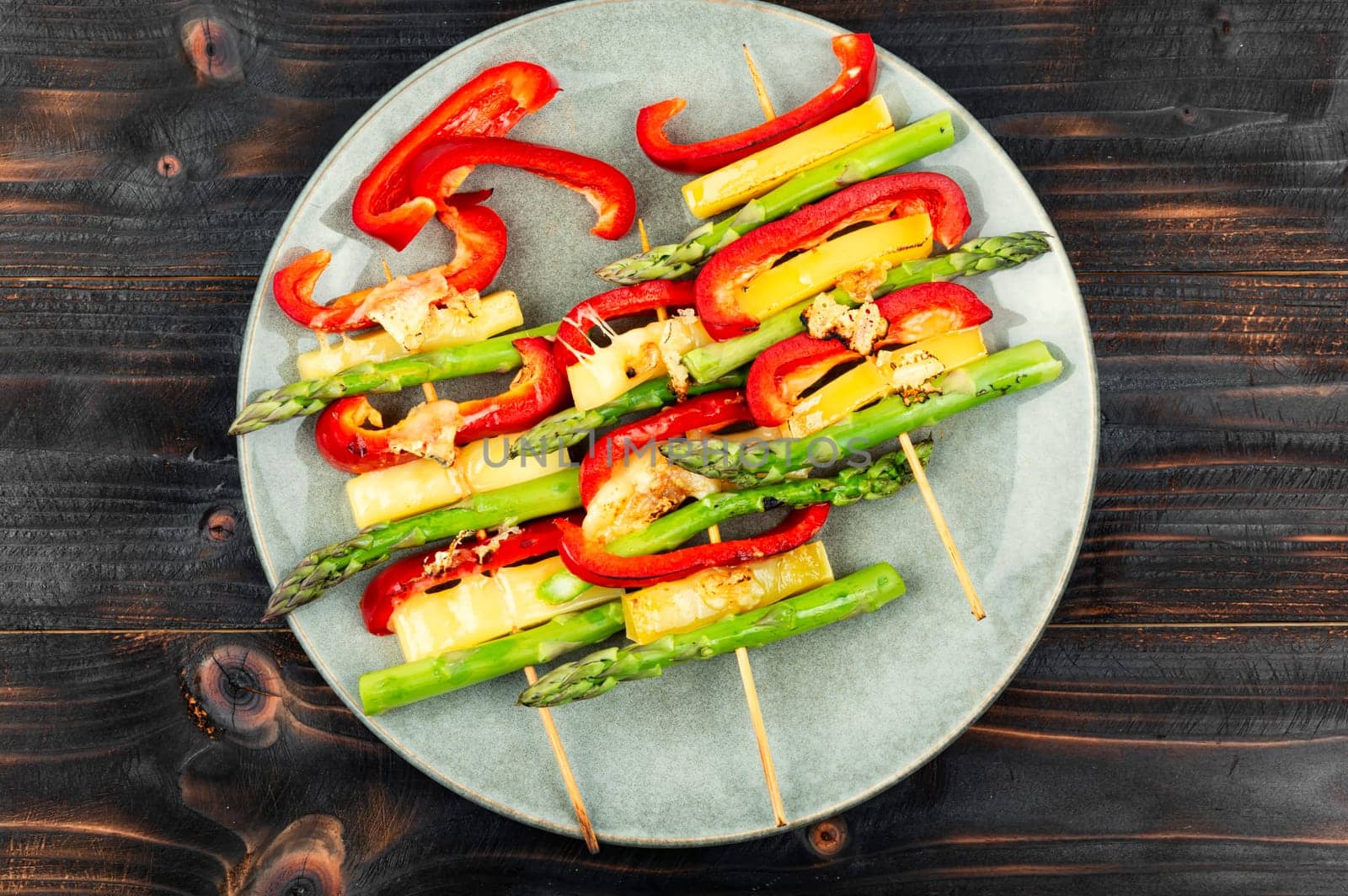 Shish kebabs with bell peppers, green asparagus, cheese. Summer barbecue food.