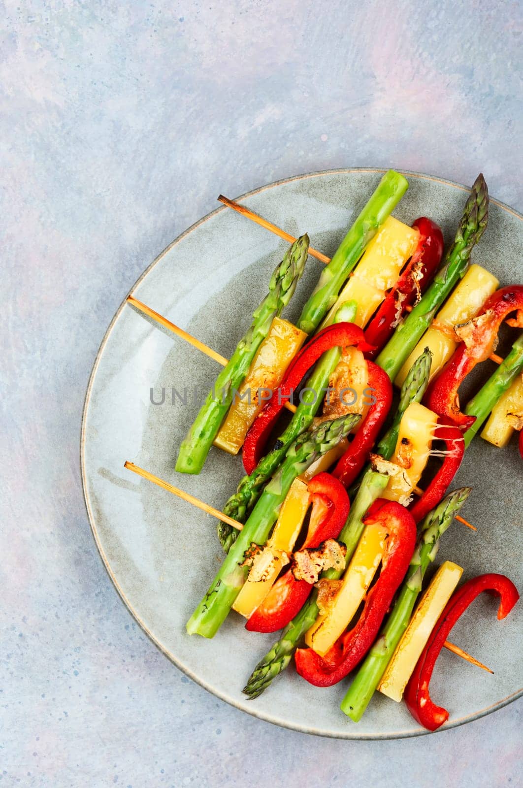 Shish kebabs with bell peppers, green asparagus, cheese. Summer barbecue food.