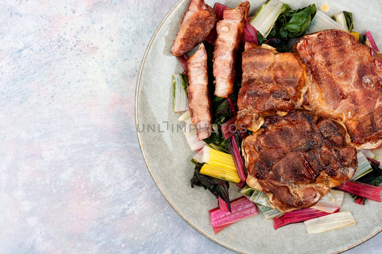 Roast meat steak with a vegetable garnish.
