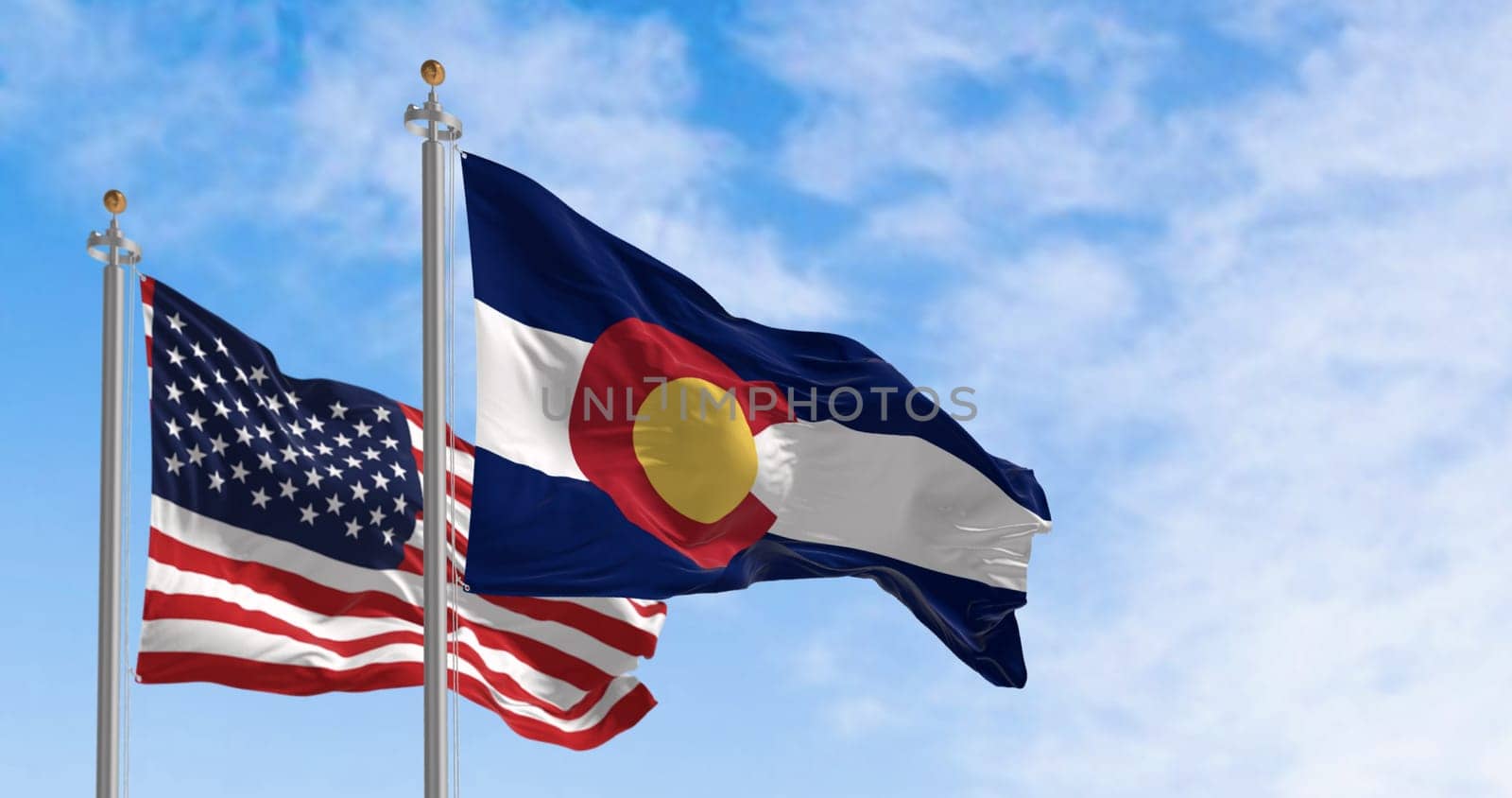 Colorado state flags waving with the national flag of the United States of America on a clear day. 3D illustration render. Rippled textile
