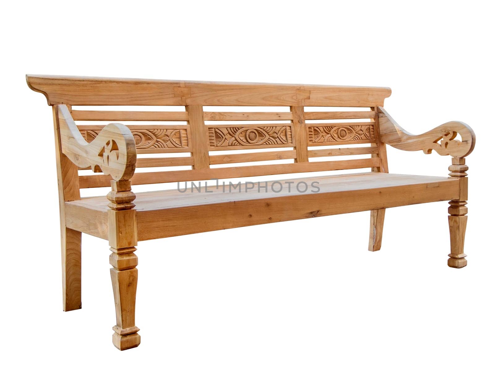 Three quarter view of a softwood garden bench with an ornate back, armrests and legs isolated on white.