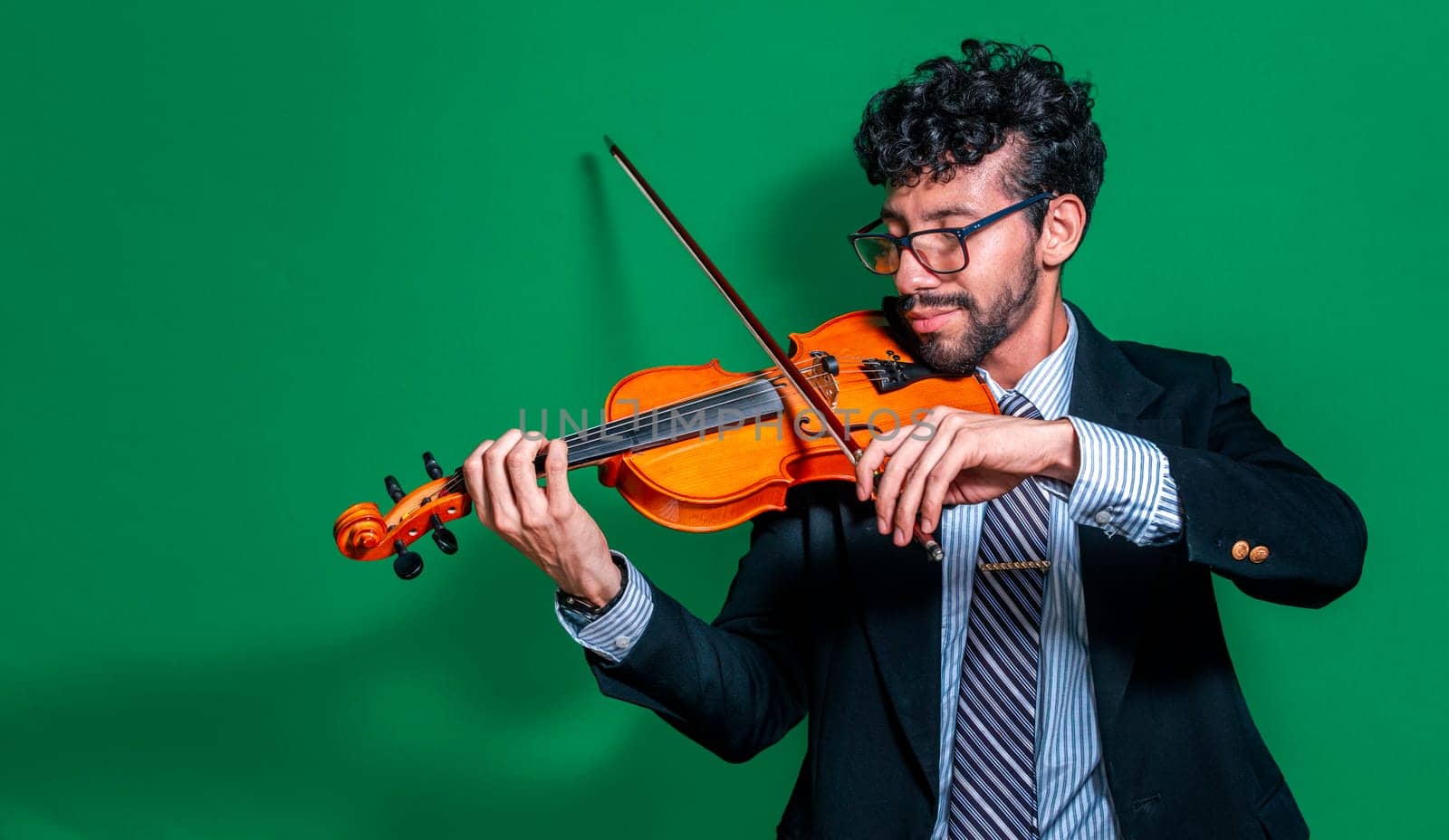 Handsome man in formal suit playing violin isolated, Close up of a music teacher playing his violin isolated, Person in suit playing violin on isolated background