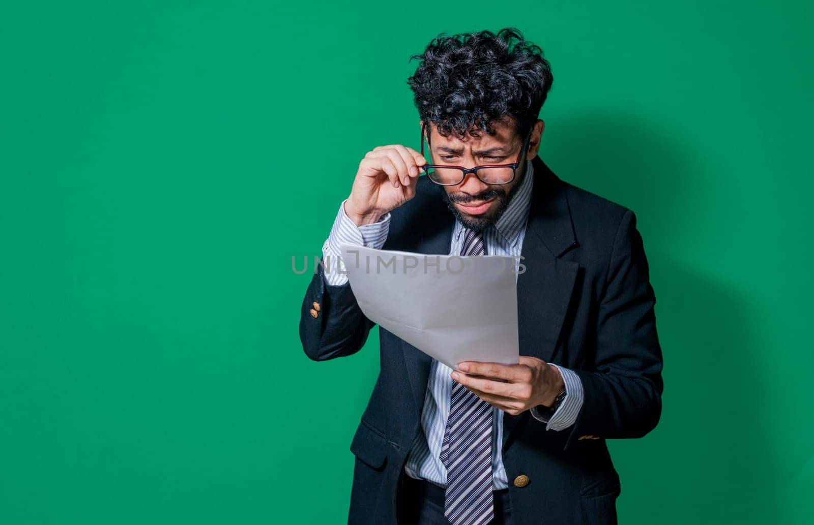 Confused businessman with documents in hand, Concept of man in formal suit frustrated with documents in hand, Businessman puzzled with documents in hand isolated