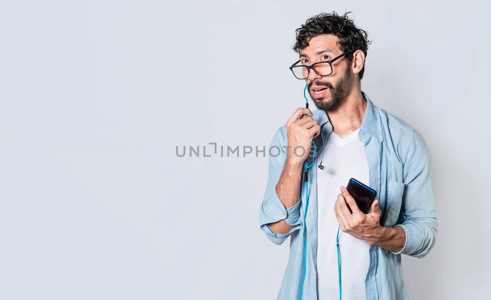 Person using handsfree on a cellphone call isolated, People on a call using handsfree. handsome man using handsfree while calling on cellphone