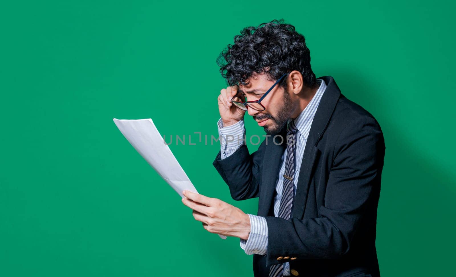Businessman puzzled with documents in hand isolated, Confused businessman with documents in hand, Concept of man in formal suit frustrated with documents in hand