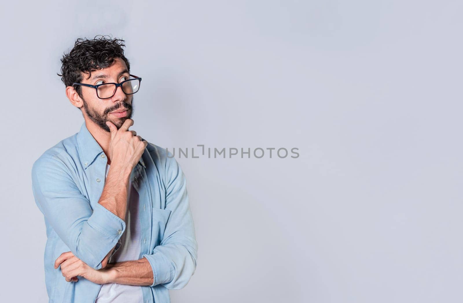 Person wondering with hand on chin looking aside isolated, People wondering with hand on chin seeing blank space, Concept of thoughtful person with hand on chin