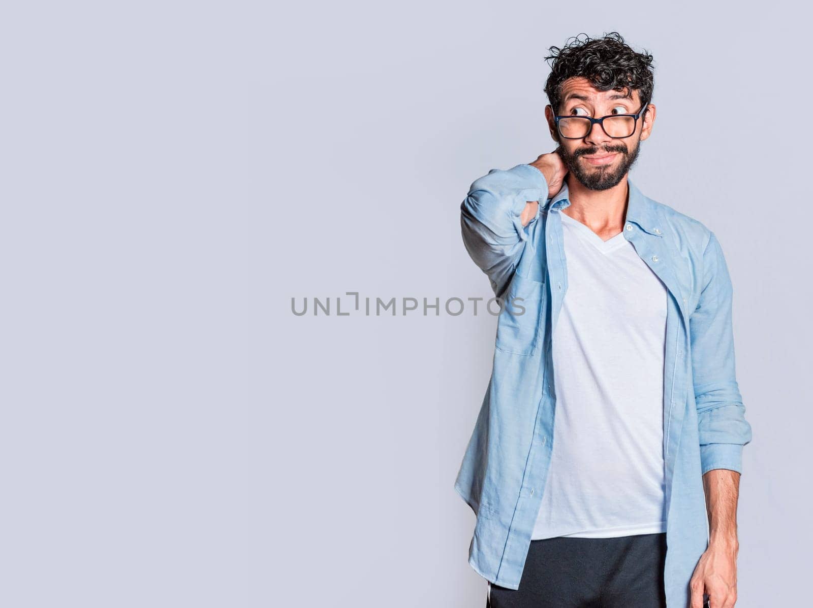 Person with uncomfortable face isolated on white background, Handsome man with uncomfortable expression isolated, Teenager with insecure expression