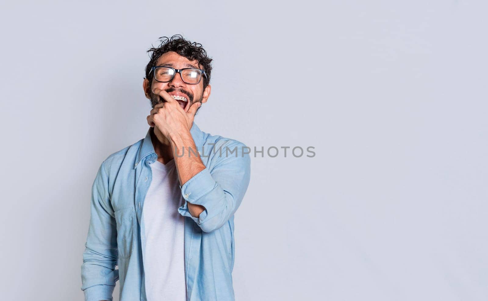A person laughing out loud at a joke. Handsome man laughing out loud on isolated background, Young man laughing out loud isolated