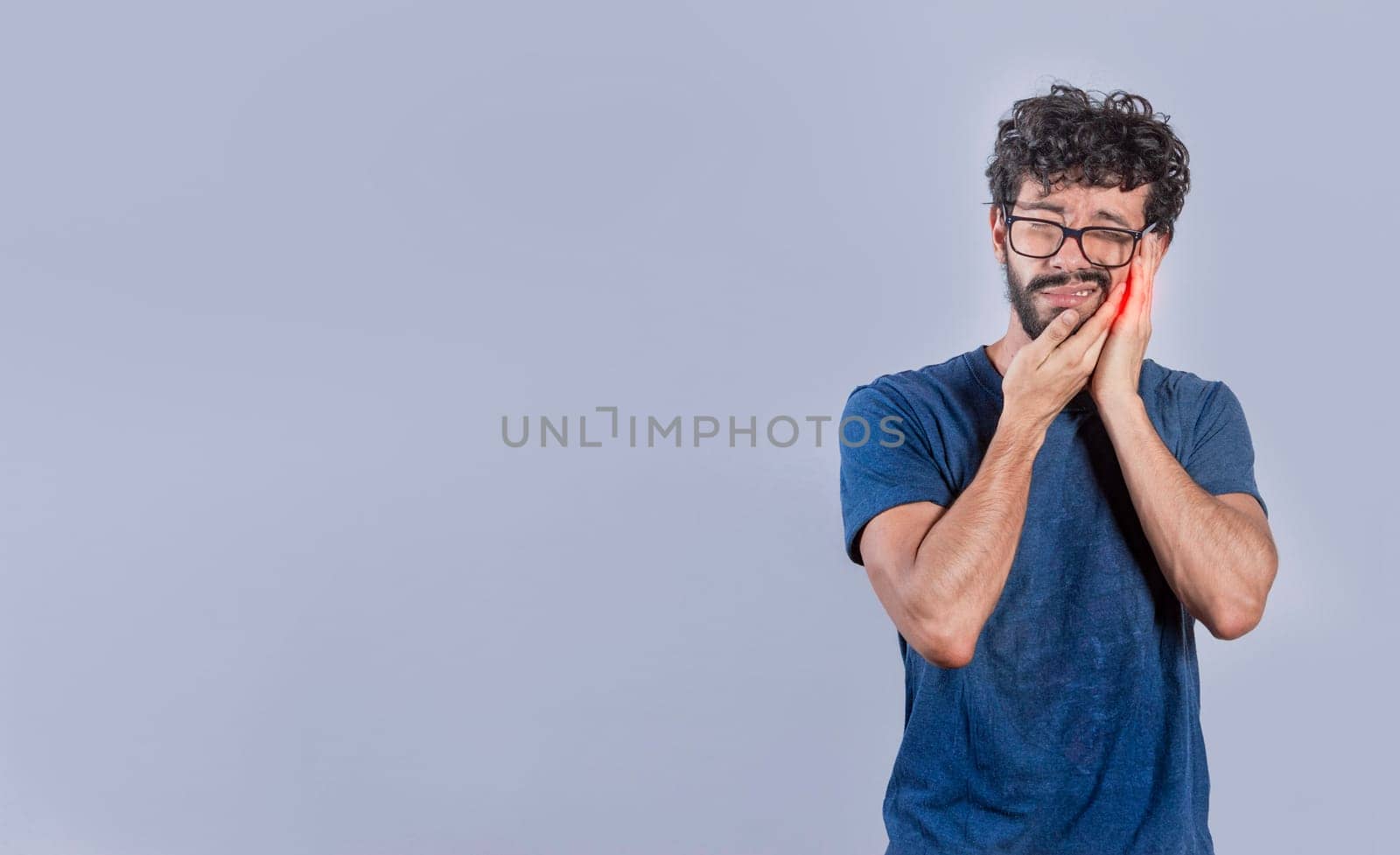 Handsome man with toothache isolated, Person with pulpitis or toothache problem, Concept of people rubbing cheek with toothache