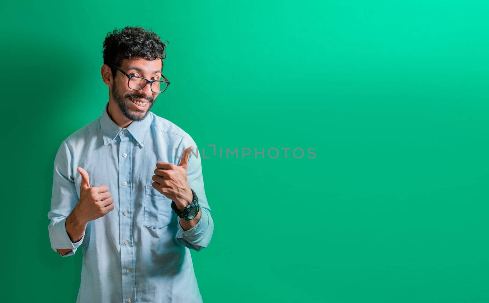 Friendly person making ok gesture, Man gesturing everything is ok, Smiling man making allright gesture and looking at camera, expression of everything is fine.