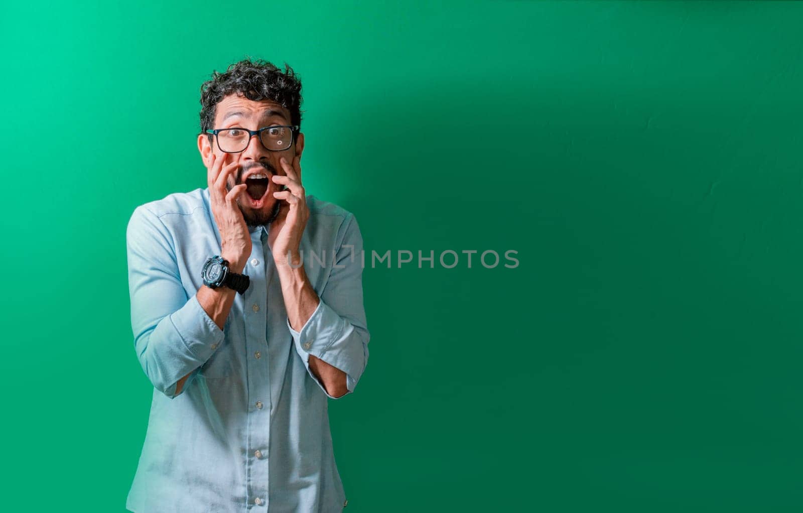 Surprised person with hands near his mouth, Astonished handsome man with hands near his mouth isolated, Concept of people with surprised and unbelievable face isolated
