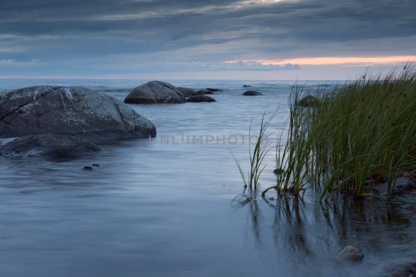 Calm Ocean with Rocks and Sea Weed.