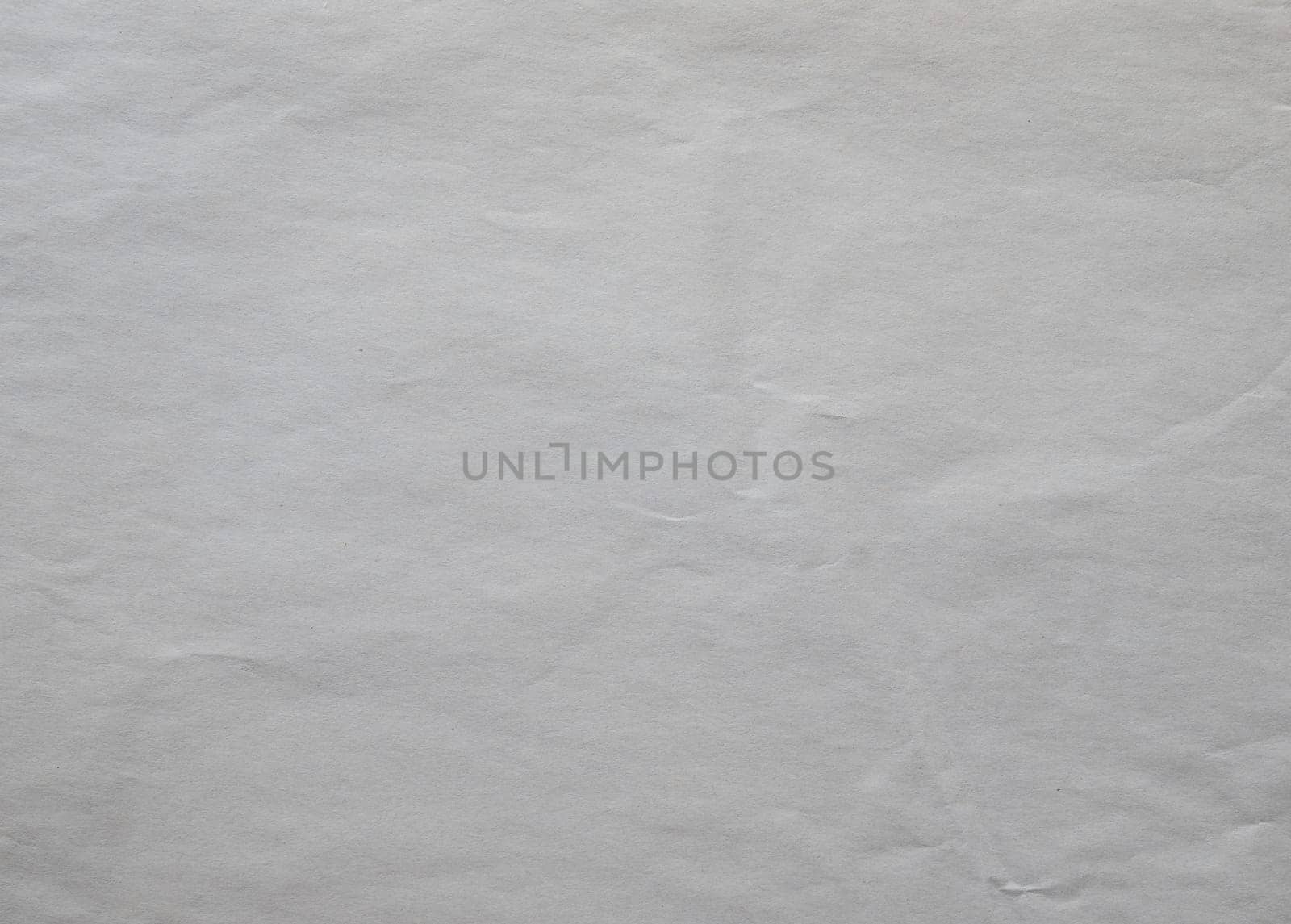 Paper texture background of off white crumpled paper sheet